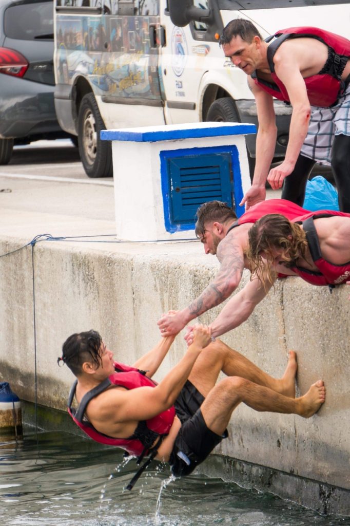 Hugh being pulled out of water